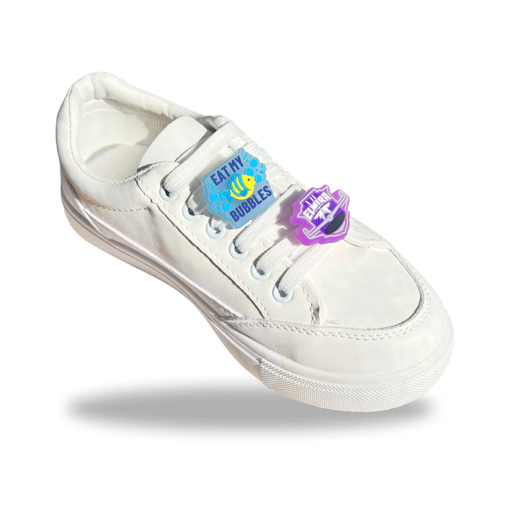 Custom clip charms – Eat My Bubbles and Elmira designs on a white sneaker