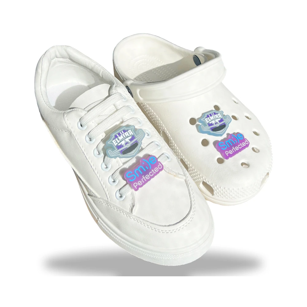 2-in-1 clog and shoelace charms – Elmira and Sm:)e Perfected designs on a white sneaker and clog