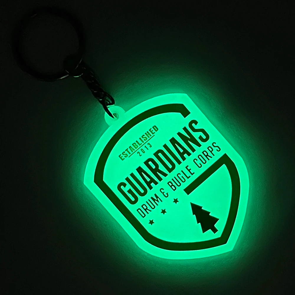 Glow in the dark rubber keychain — glows green in the dark