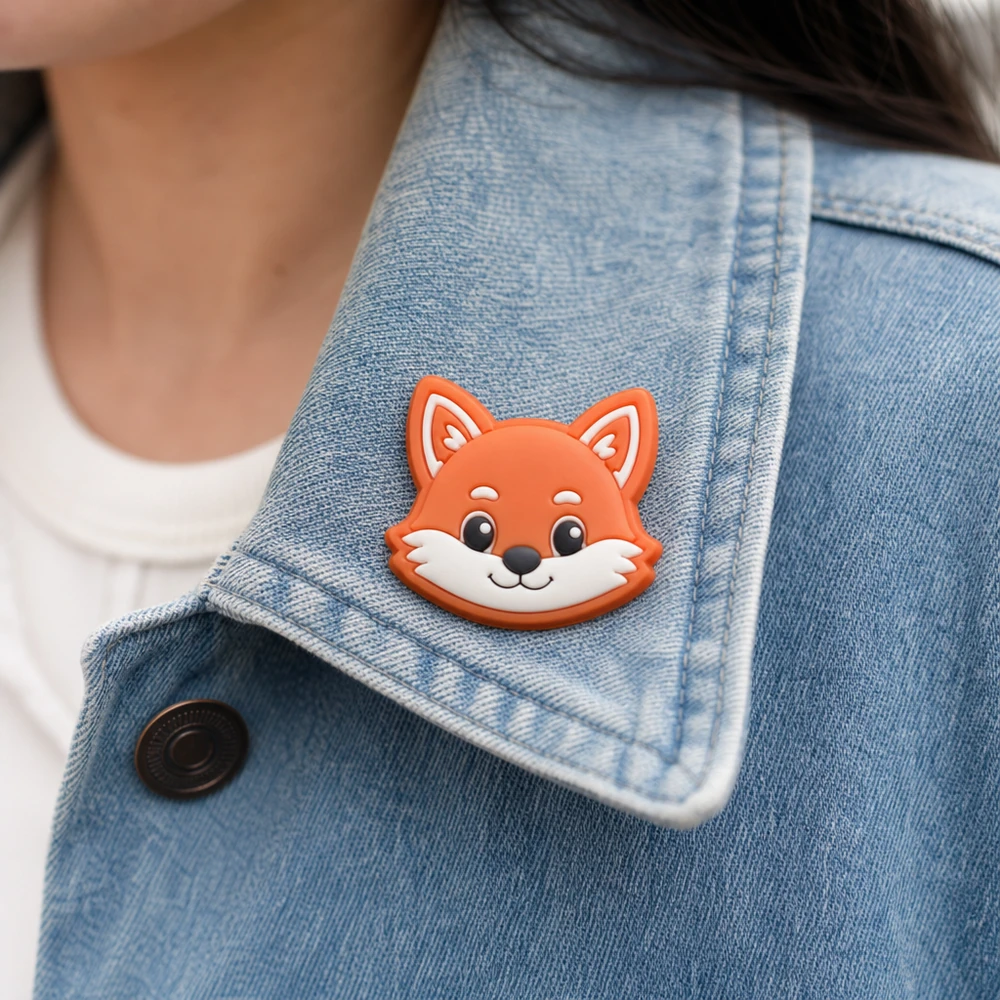 Custom soft PVC rubber pin worn on a denim jacket lapel