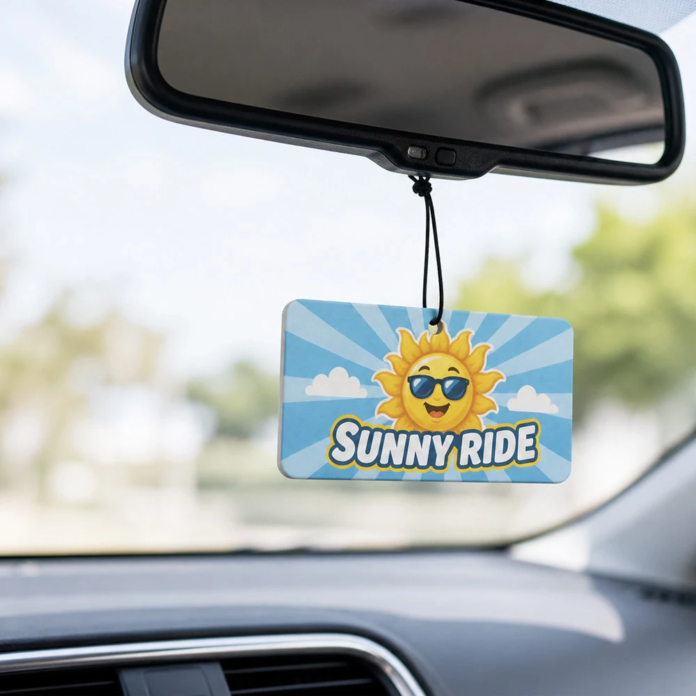 Custom rectangular Sunny Ride air freshener hanging from a car rearview mirror UK