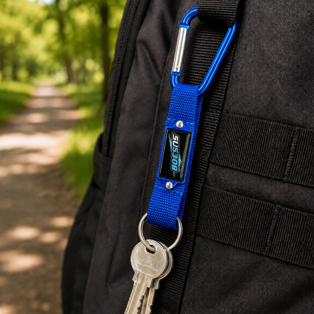 Custom aluminium carabiner keychain clipped to a backpack strap outdoors UK