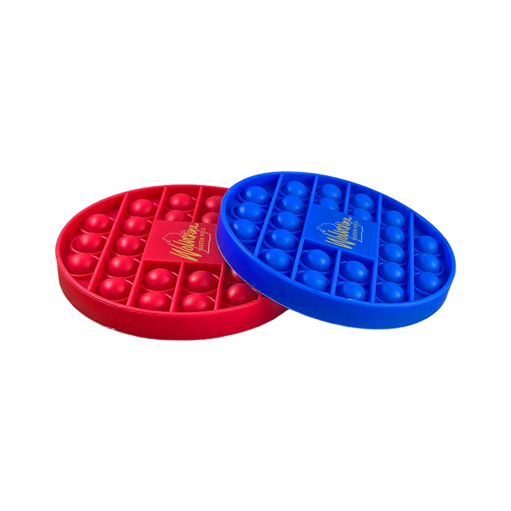 Two custom silicone pop bubble coasters in red and blue