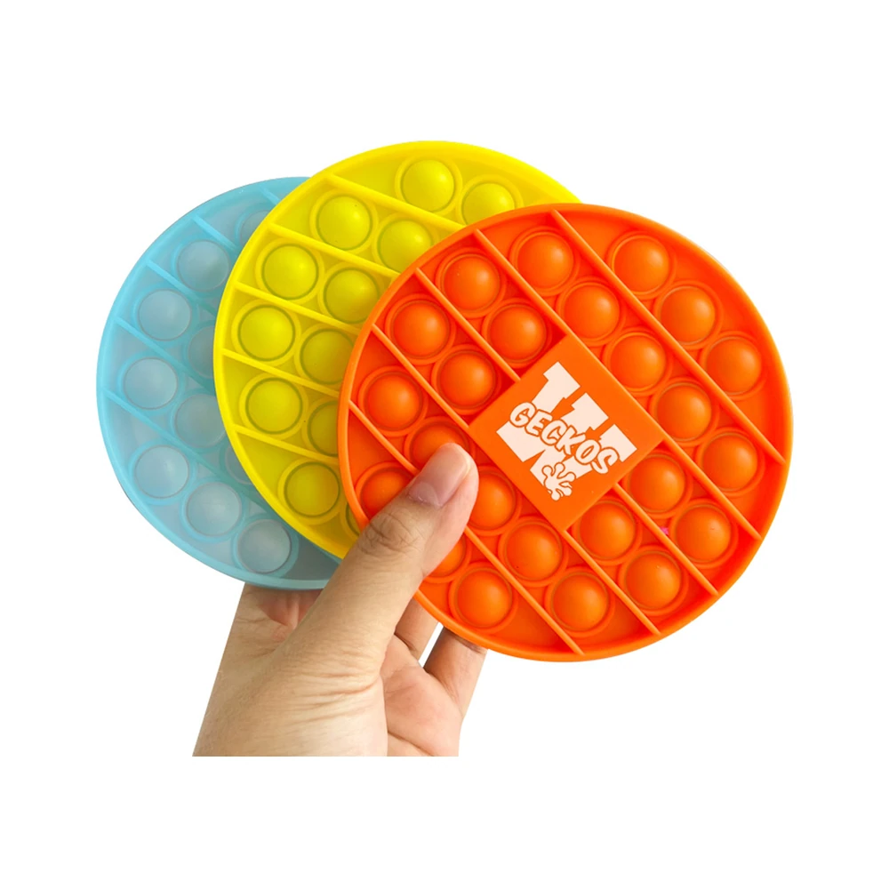 Three custom silicone pop bubble coasters in blue, yellow and orange