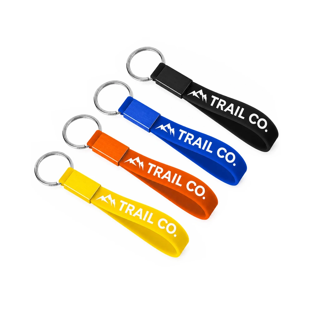 Custom silicone wrist loop keychains in black, blue, orange, and yellow Australia
