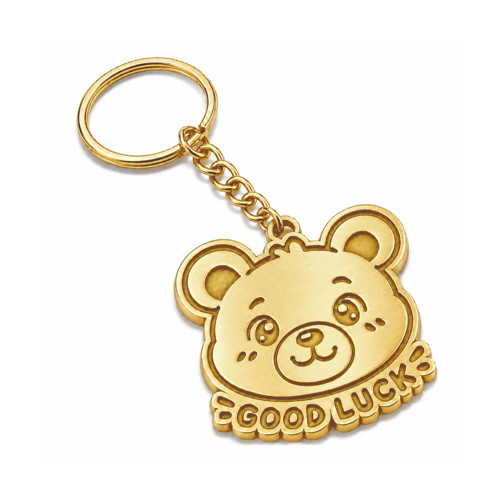 Custom zinc metal keychain in gold plating with engraved bear good luck design Australia